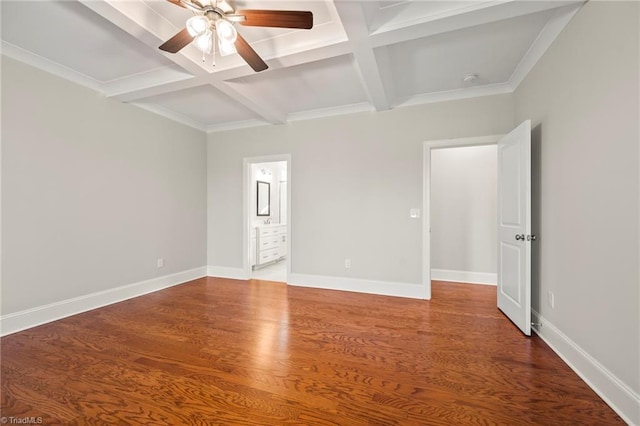 unfurnished bedroom featuring coffered ceiling, beamed ceiling, baseboards, and wood finished floors