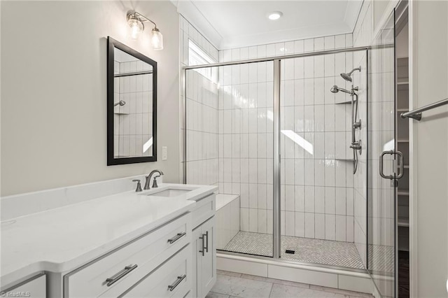 bathroom featuring a stall shower and vanity