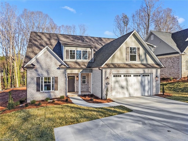 view of front of house with a front yard, concrete driveway, and brick siding