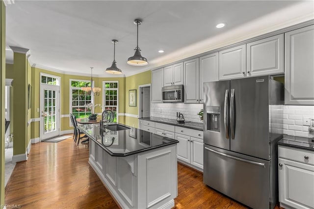 3116 Lodge Dr, Jamestown, NC 27282 - kitchen featuring appliances with stainless steel finishes, a sink, backsplash, recessed lighting, and pendant lighting