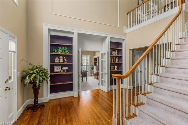 3116 Lodge Dr, Jamestown, NC 27282 - entrance foyer with a towering ceiling, wood finished floors, stairs, and baseboards