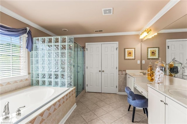 3116 Lodge Dr, Jamestown, NC 27282 - bathroom featuring vanity, a shower stall, a bath, tile patterned floors, and crown molding