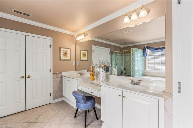 3116 Lodge Dr, Jamestown, NC 27282 - bathroom featuring double vanity, a stall shower, tile patterned floors, ornamental molding, and tile walls