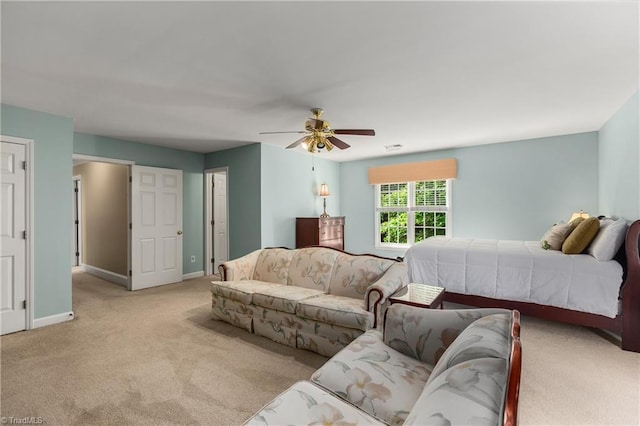 3116 Lodge Dr, Jamestown, NC 27282 - bedroom featuring light carpet, baseboards, and ceiling fan