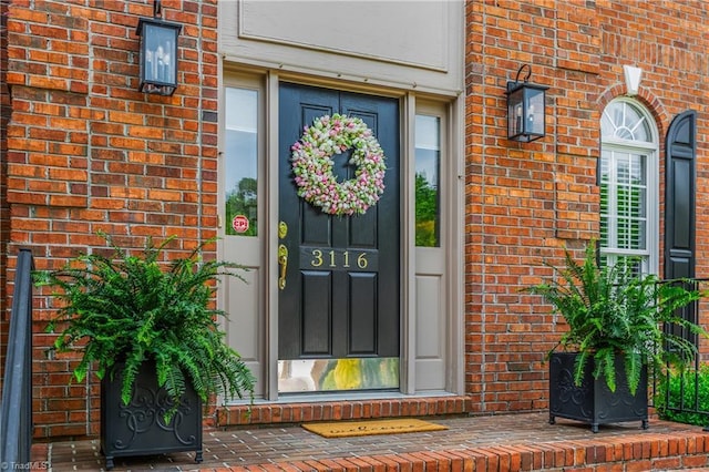 3116 Lodge Dr, Jamestown, NC 27282 - view of exterior entry featuring brick siding