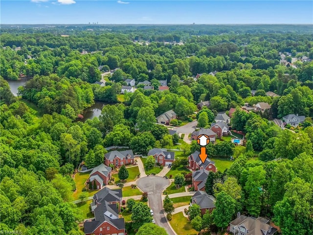 3116 Lodge Dr, Jamestown, NC 27282 - aerial perspective of suburban area featuring a forest and a nearby body of water
