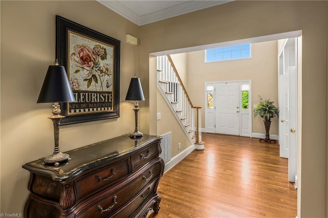 3116 Lodge Dr, Jamestown, NC 27282 - entryway featuring wood finished floors, stairs, ornamental molding, and baseboards
