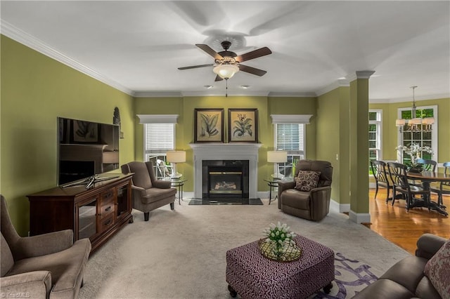 3116 Lodge Dr, Jamestown, NC 27282 - living area featuring a high end fireplace, plenty of natural light, ceiling fan, ornamental molding, and baseboards