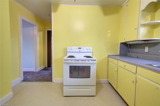 kitchen featuring baseboards, open shelves, and electric range