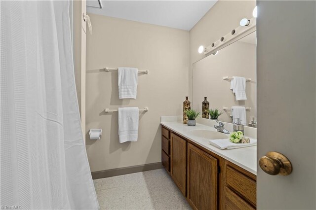 bathroom with vanity and tile patterned flooring