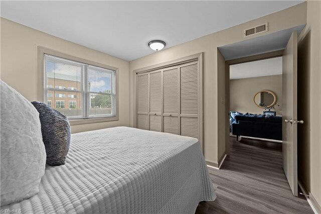 bedroom featuring a closet and hardwood / wood-style flooring