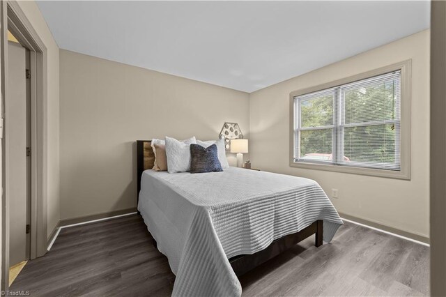 bedroom featuring dark hardwood / wood-style floors