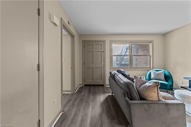 living room with dark hardwood / wood-style floors