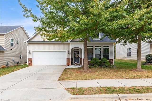 view of front of house with a front lawn and a garage