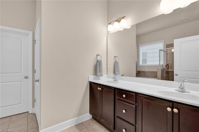 bathroom with vanity, walk in shower, and tile patterned flooring