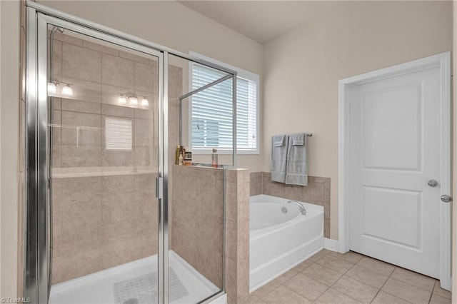 bathroom featuring separate shower and tub and tile patterned floors