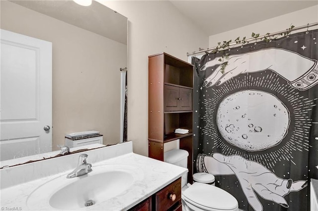 bathroom featuring vanity and toilet