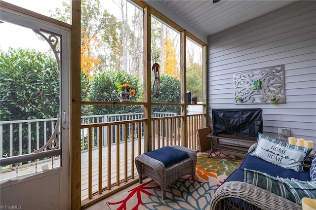 sunroom / solarium featuring wooden ceiling