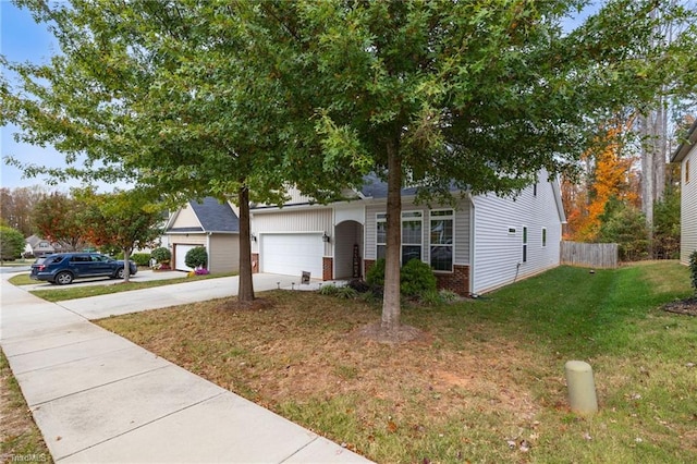 view of front facade featuring a front lawn and a garage