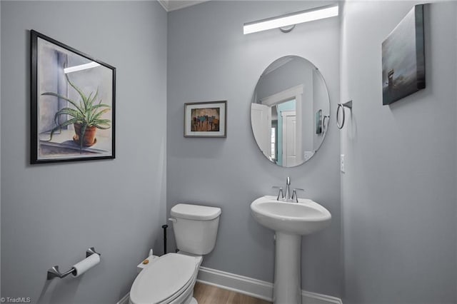 7615 Mary Ellen Ct, Greensboro, NC 27409 - bathroom with toilet and wood finished floors