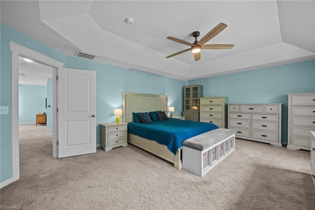 7615 Mary Ellen Ct, Greensboro, NC 27409 - bedroom featuring a raised ceiling, carpet flooring, and a ceiling fan
