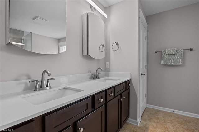 7615 Mary Ellen Ct, Greensboro, NC 27409 - bathroom featuring double vanity and baseboards