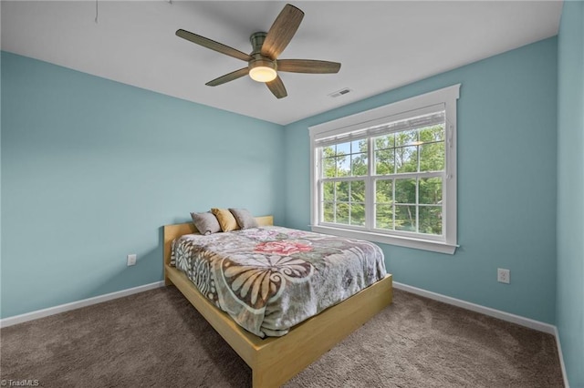 7615 Mary Ellen Ct, Greensboro, NC 27409 - carpeted bedroom with baseboards and ceiling fan