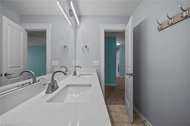 7615 Mary Ellen Ct, Greensboro, NC 27409 - bathroom with double vanity and baseboards