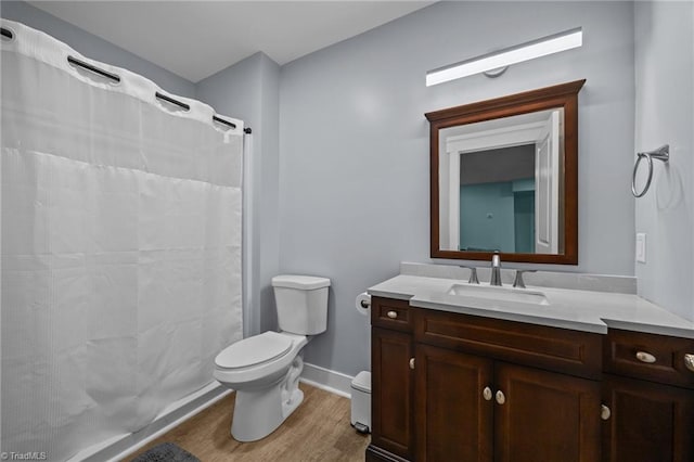 7615 Mary Ellen Ct, Greensboro, NC 27409 - bathroom with wood finished floors, vanity, and a shower with shower curtain