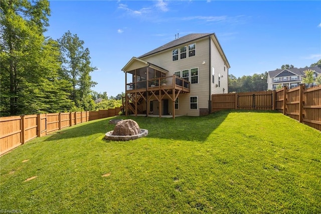 7615 Mary Ellen Ct, Greensboro, NC 27409 - back of property featuring a sunroom, an outdoor fire pit, a fenced backyard, and stairway