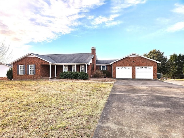 ranch-style house with a garage and a front yard