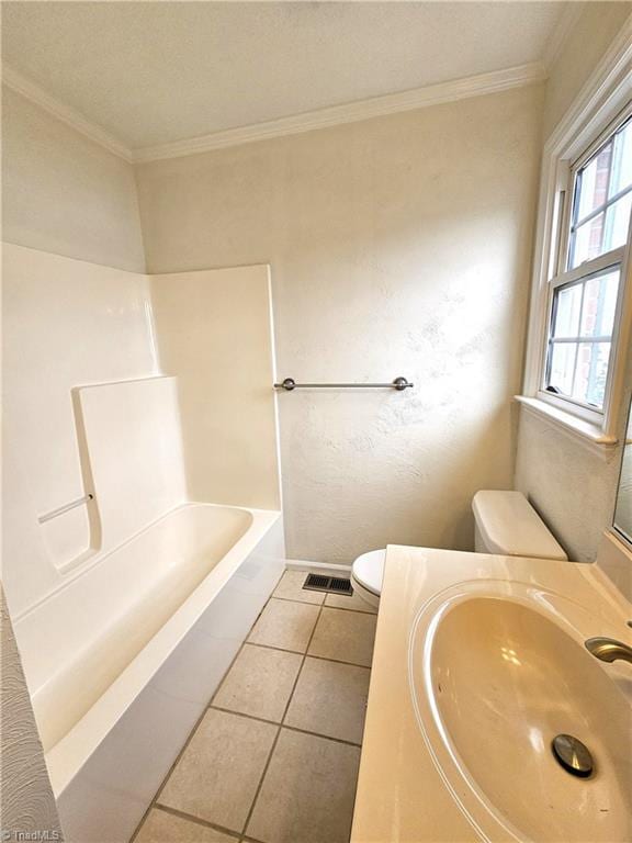 full bathroom featuring vanity, tile patterned floors, ornamental molding, and toilet