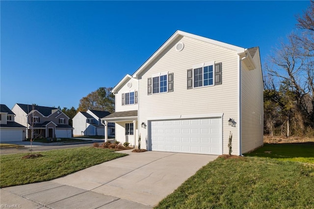 view of property featuring a front yard and a garage