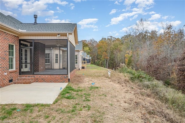 view of yard featuring a patio area and ceiling fan