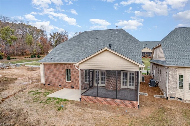 rear view of property with central air condition unit, a patio, and french doors