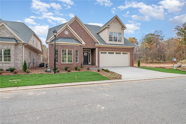 craftsman house featuring a garage and a front lawn