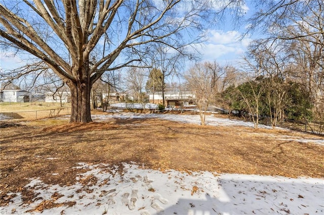 view of yard layered in snow