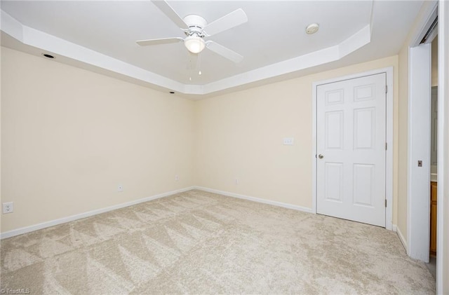 711 Sunset Ave Unit B, Asheboro, NC 27203 - carpeted spare room with a tray ceiling, ceiling fan, and baseboards