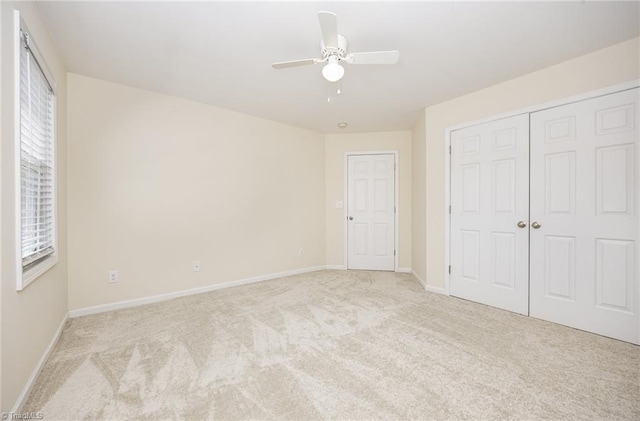711 Sunset Ave Unit B, Asheboro, NC 27203 - unfurnished bedroom with carpet floors, a closet, baseboards, and a ceiling fan