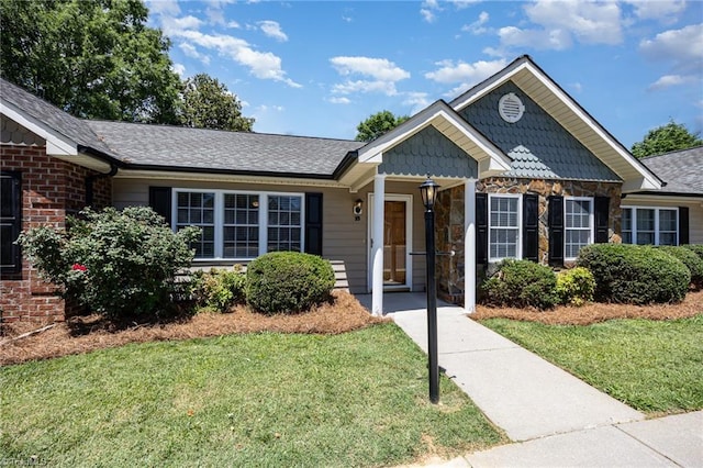 711 Sunset Ave Unit B, Asheboro, NC 27203 - ranch-style house with a front lawn, stone siding, and a shingled roof