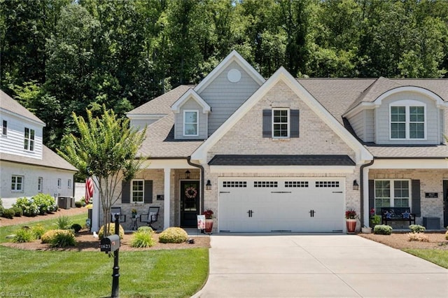 1623 Angus Ridge Dr, Kernersville, NC 27284 - view of front of house featuring a porch, driveway, a front yard, and roof with shingles