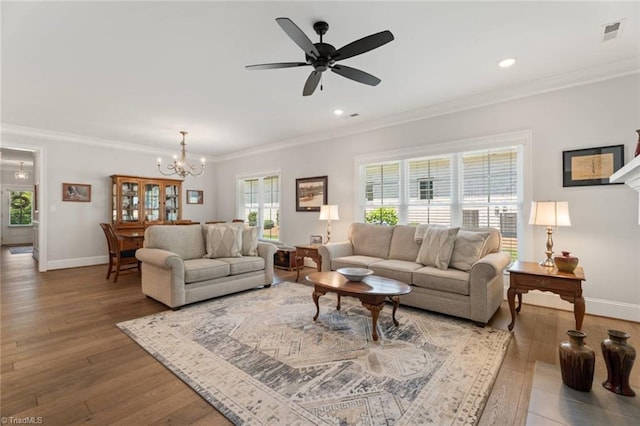 1623 Angus Ridge Dr, Kernersville, NC 27284 - living area with ornamental molding, a chandelier, wood finished floors, recessed lighting, and a ceiling fan