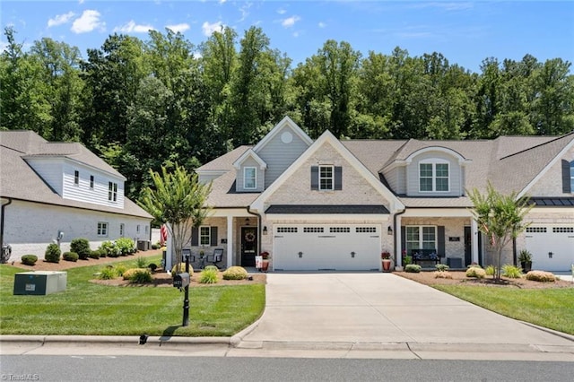 1623 Angus Ridge Dr, Kernersville, NC 27284 - view of front of house with driveway, a front yard, and a garage
