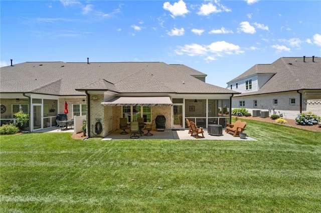 1623 Angus Ridge Dr, Kernersville, NC 27284 - back of house with ceiling fan, a patio, a sunroom, and brick siding