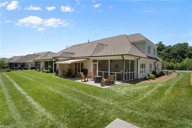 1623 Angus Ridge Dr, Kernersville, NC 27284 - rear view of property featuring a patio area, a yard, a sunroom, and ceiling fan