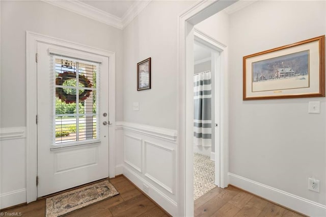 1623 Angus Ridge Dr, Kernersville, NC 27284 - doorway to outside featuring crown molding, healthy amount of natural light, wood finished floors, and wainscoting