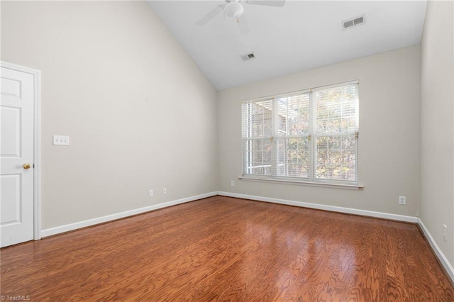 spare room with hardwood / wood-style flooring, ceiling fan, and high vaulted ceiling