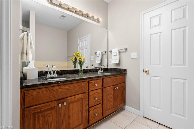 bathroom with vanity and tile patterned flooring