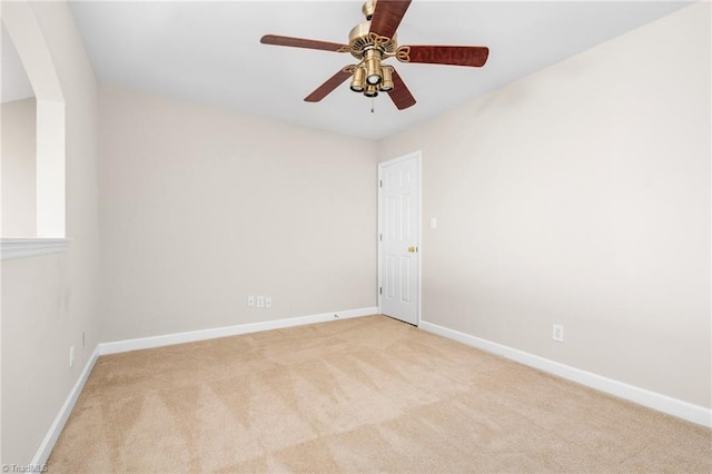 carpeted empty room with ceiling fan