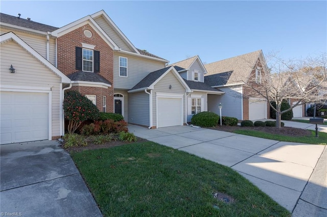 view of front of home with a front yard and a garage